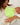 Woman holding a baby with text overlay about newborn essentials in New South Wales.