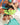 Children lying on a blue surface with text overlay 'Join the Golden Child Referral Program' in green.