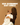 Woman holding a baby with text 'NSW Government Baby Bundle' on a brown background