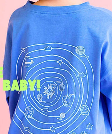 Blue sweatshirt with space-themed design and text on a pink background